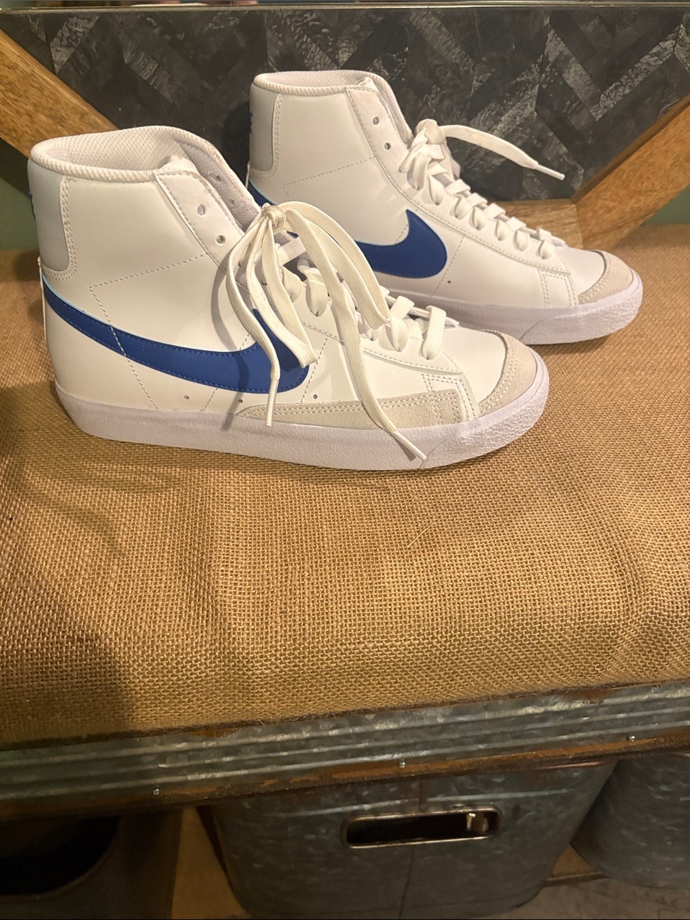 Nike Women's White High-Top Sneakers with Blue Swoosh